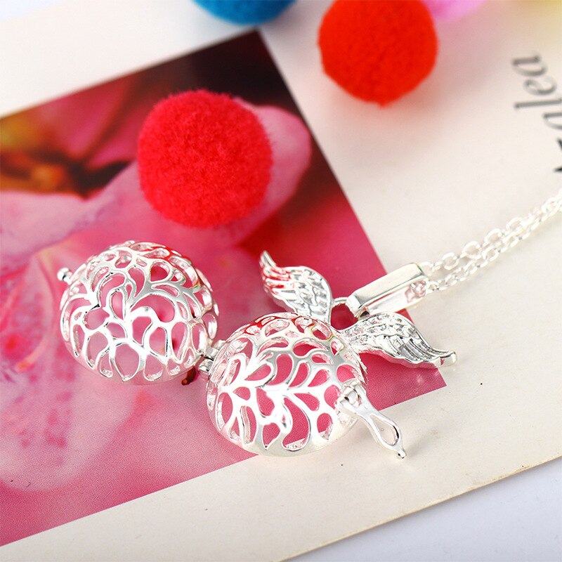 Collier lumineux en ailes d'ange pendentif en boule creuse