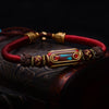 Brazaletes tibetanos con perlas de bronce.